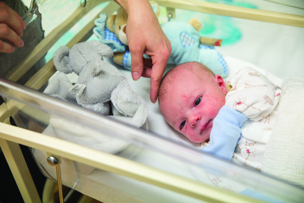 Photograph of a close up of a new born baby