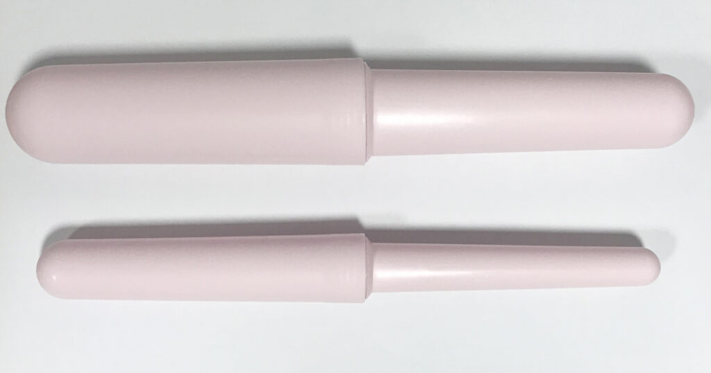 An image showing two vaginal dilators of different sizes.