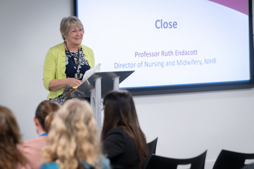 Professor Ruth Eldacott presenting as a slide with the word "Close"