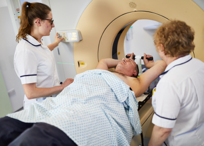 A photograph of a patient having a planning CT scan.