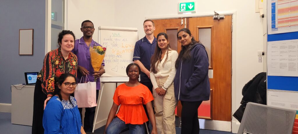 students with training team, smiling