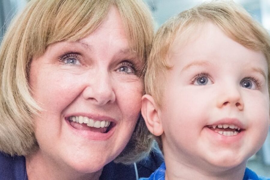 Nurse smiling with young child