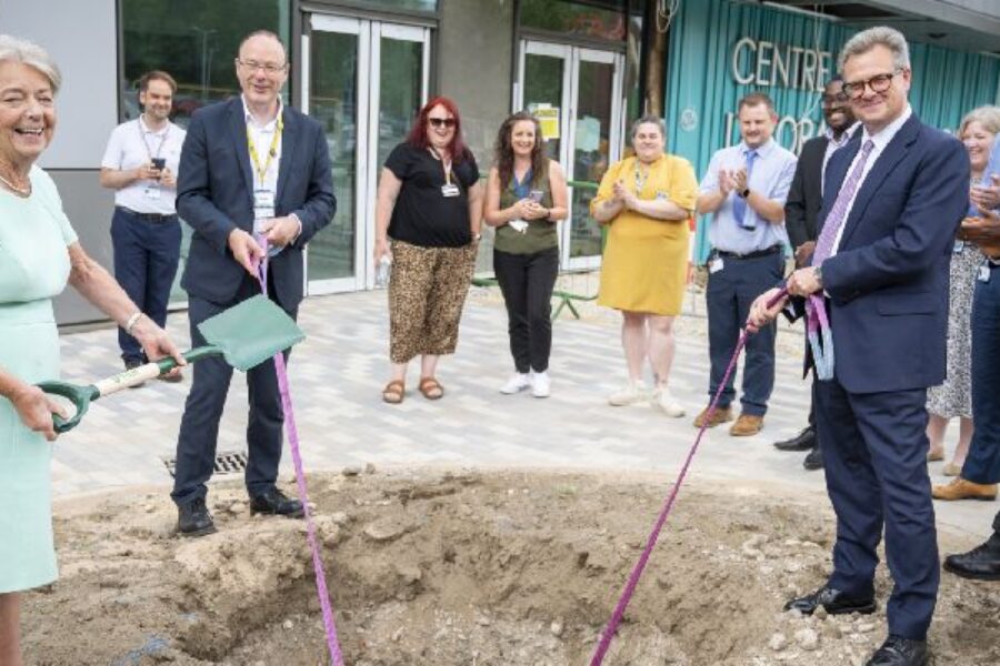 Picture of Dame Linda Pollard and Professor Phil Woods burying the capsule outside the new Pathology building